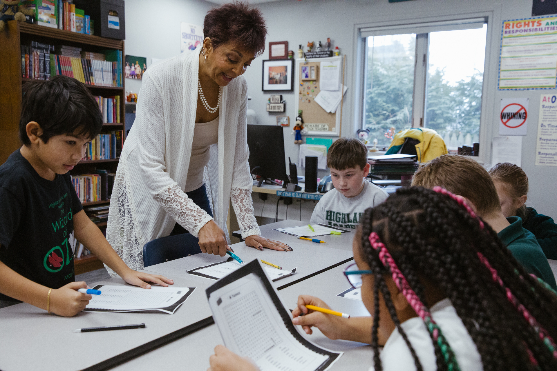 Highland Academy teacher working with students in an Absecon, NJ classroom